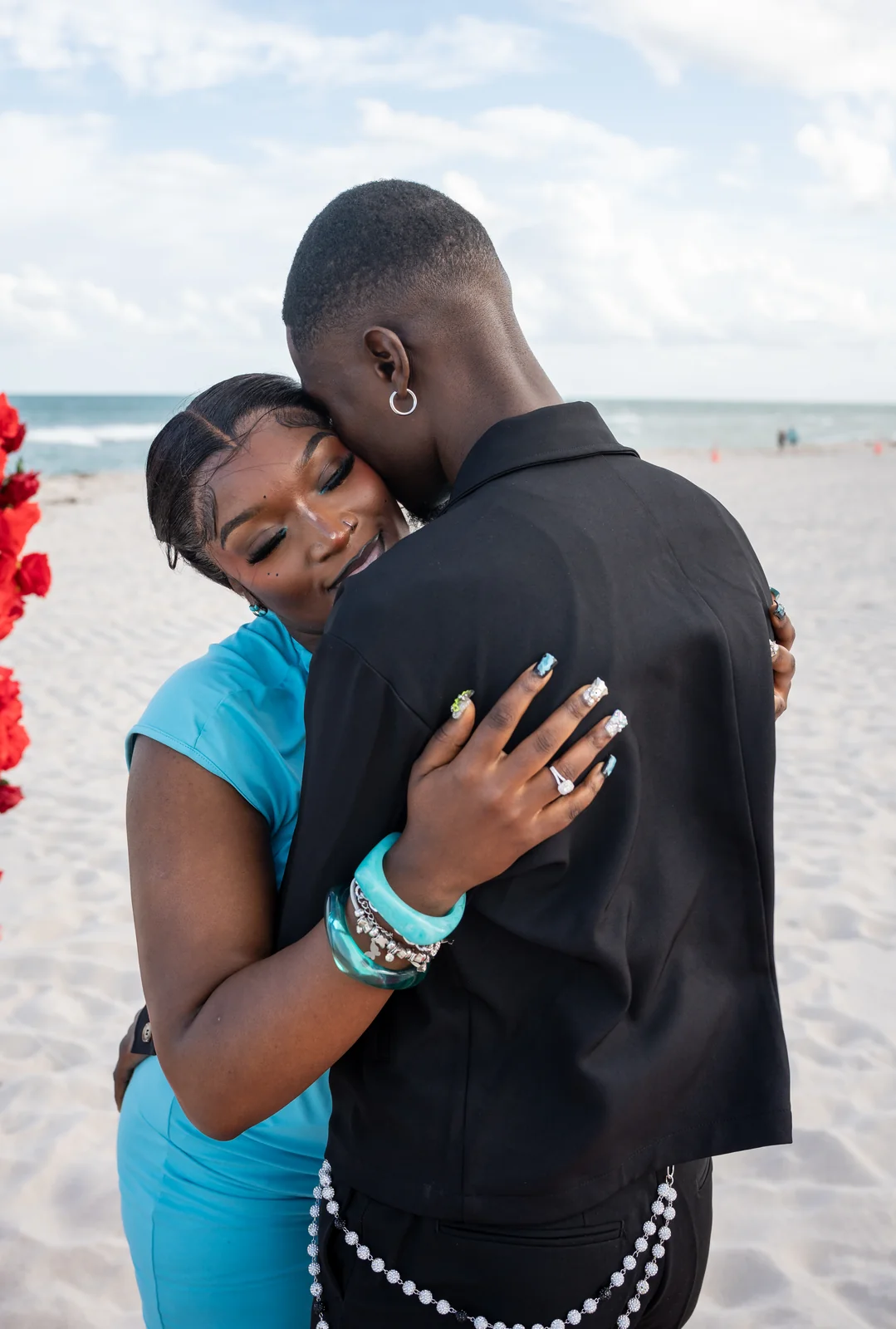 The couple embraces after the proposal.